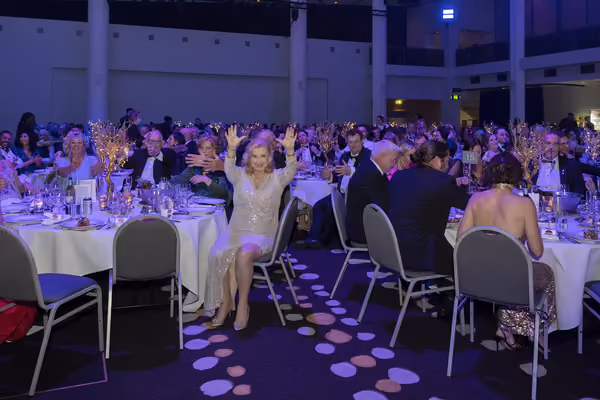 Jason Gray performing at a large corporate event