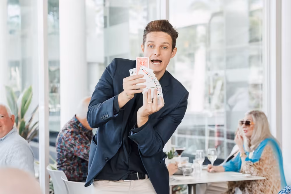 Jason Gray performing close-up magic at an event
