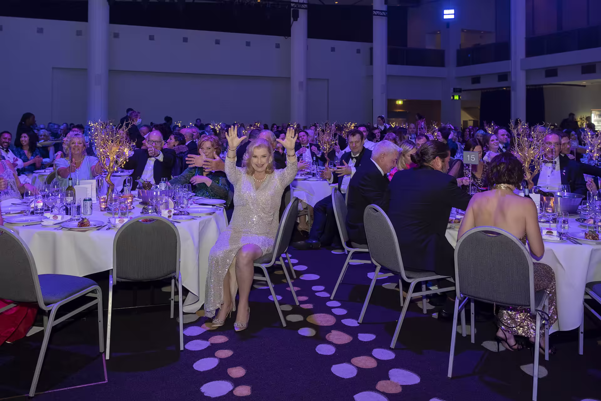 Guests gathered at a formal event with live entertainment